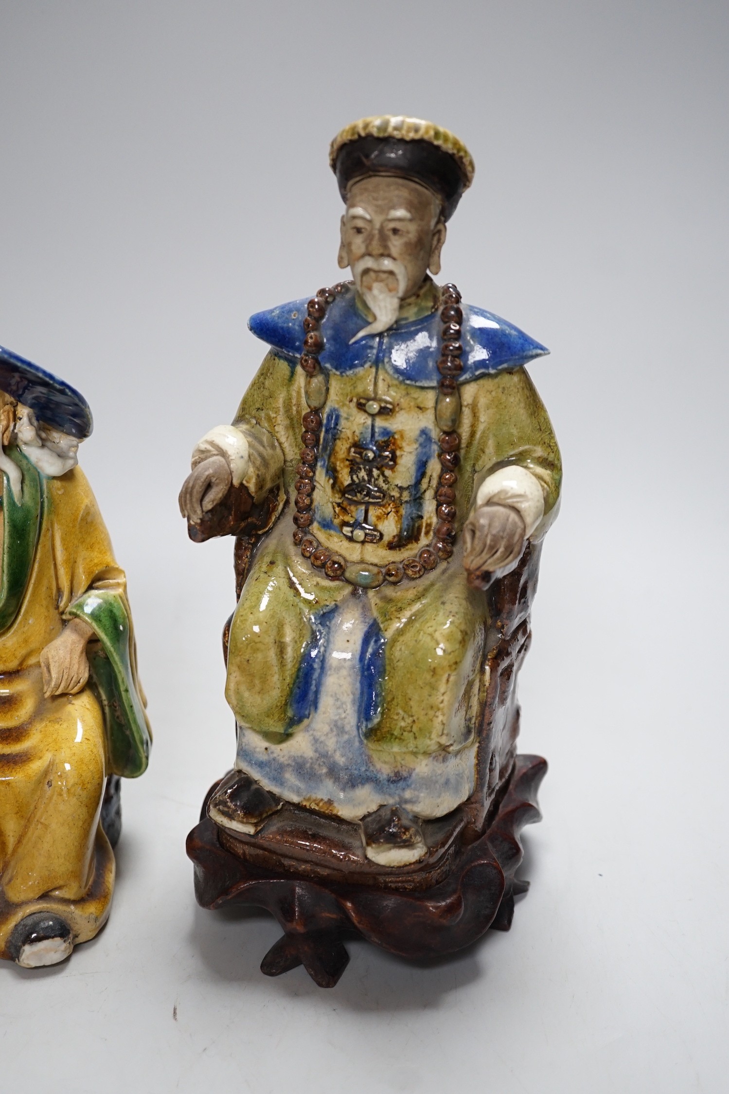 Three Chinese Shiwan pottery figures of an Emperor, Li Bai and an old man, tallest 23cm